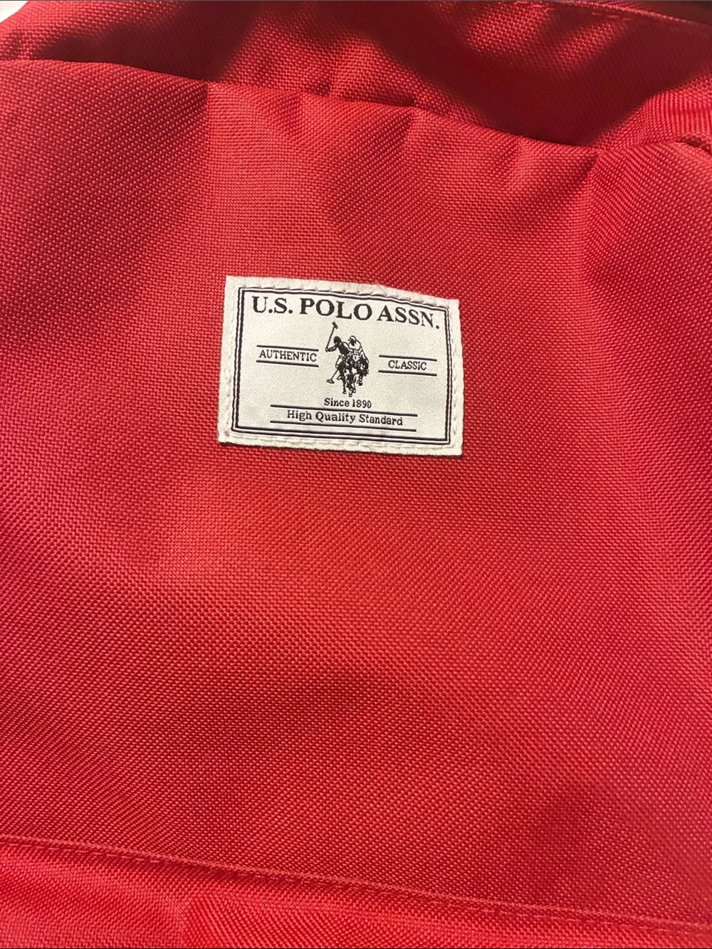 U.S. Polo Assn.Red Unisex 18”solid core backpack w/large main zipped compartment